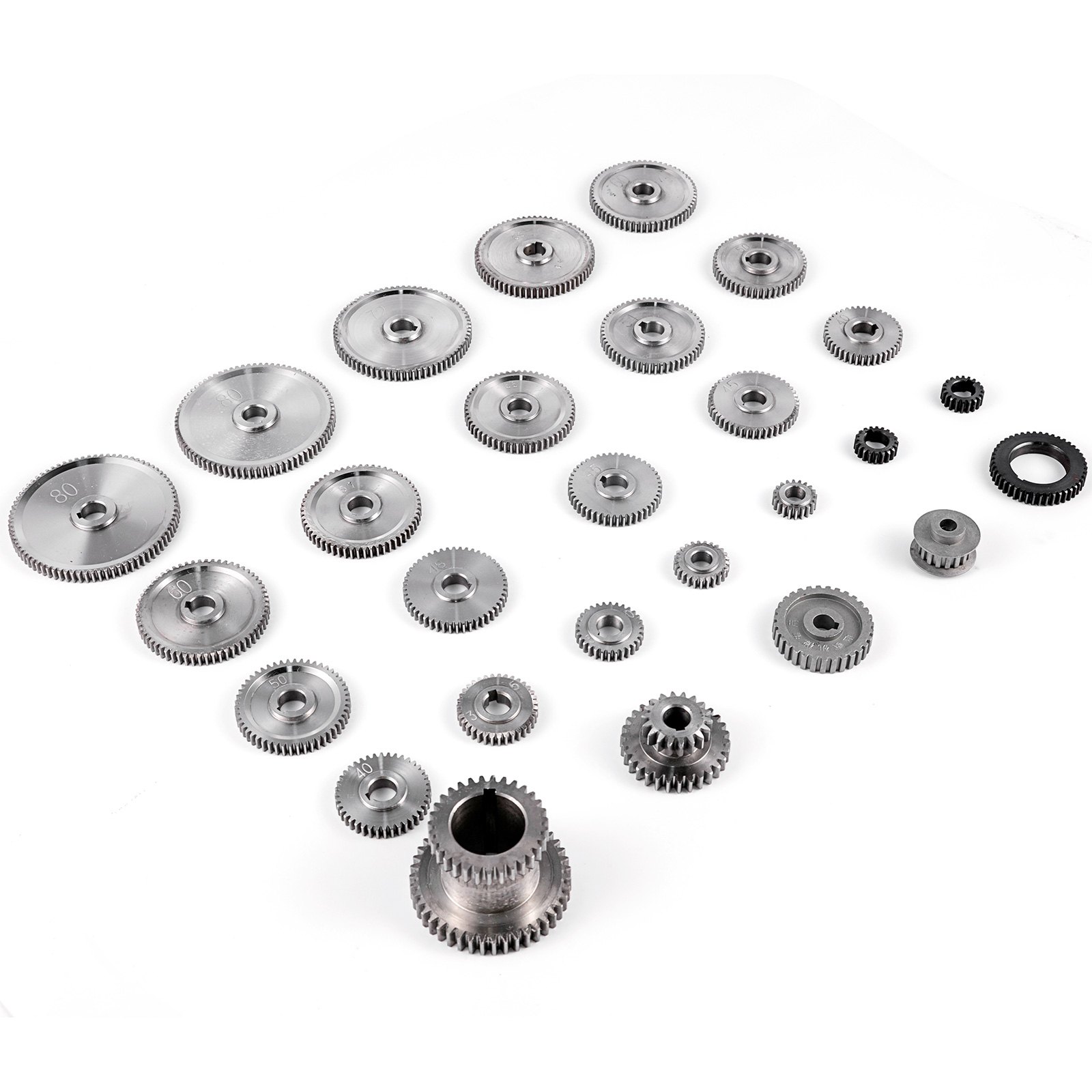 various sizes of VEVOR mini lathe gears arranged on a white surface.