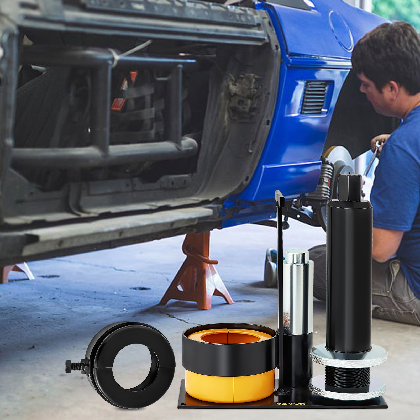 VEVOR pinion bearing puller set under a lifted car being repaired.