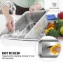 washing VEVOR steam table pans under a faucet, showcasing easy cleaning process.