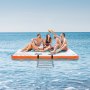 group of friends enjoying the VEVOR inflatable floating dock on a sunny day in the ocean.