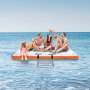 family enjoying VEVOR inflatable floating dock on a serene ocean, with ladder and vibrant blue water.