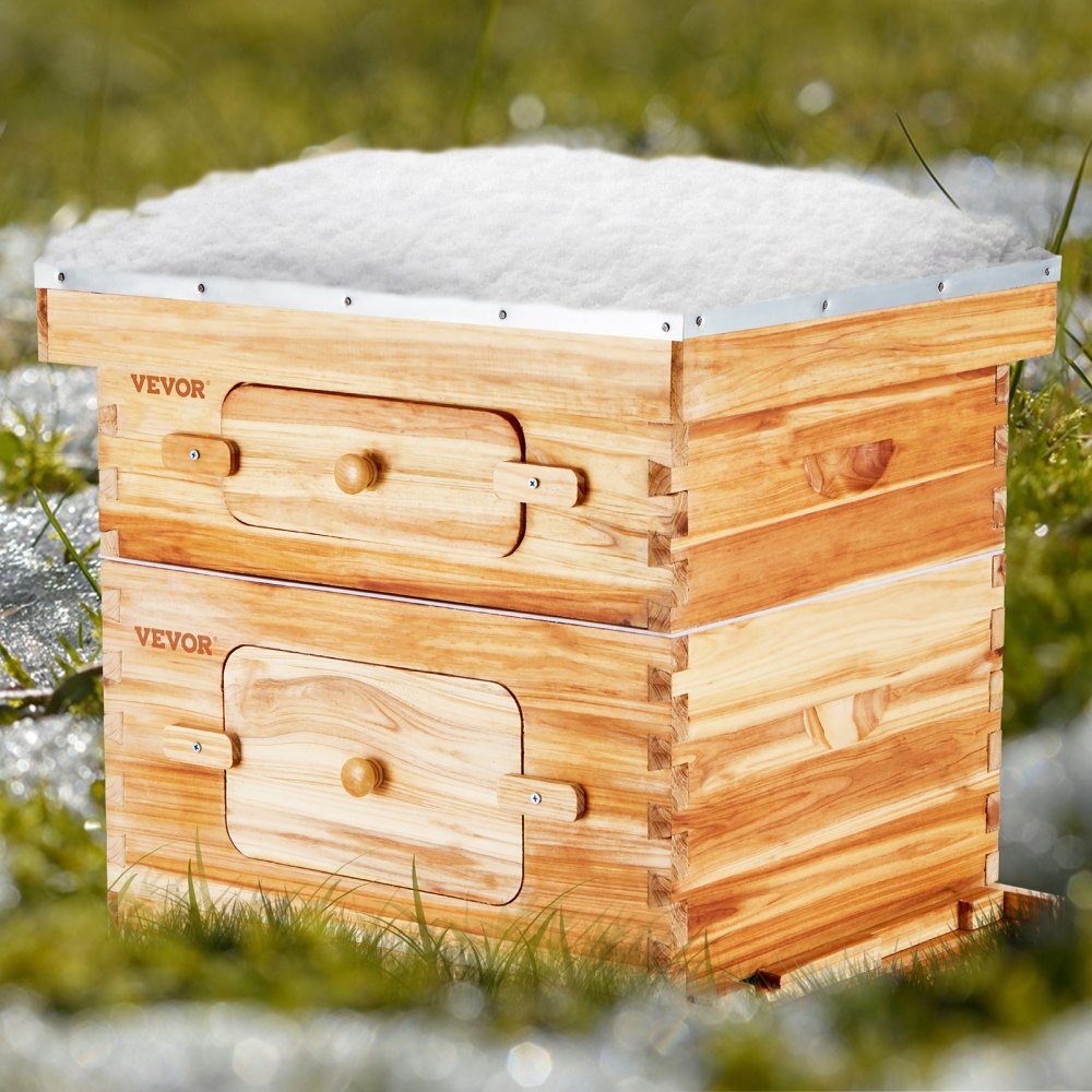 VEVOR bee hive starter kit in a grassy field, wooden structure with a snowy top.