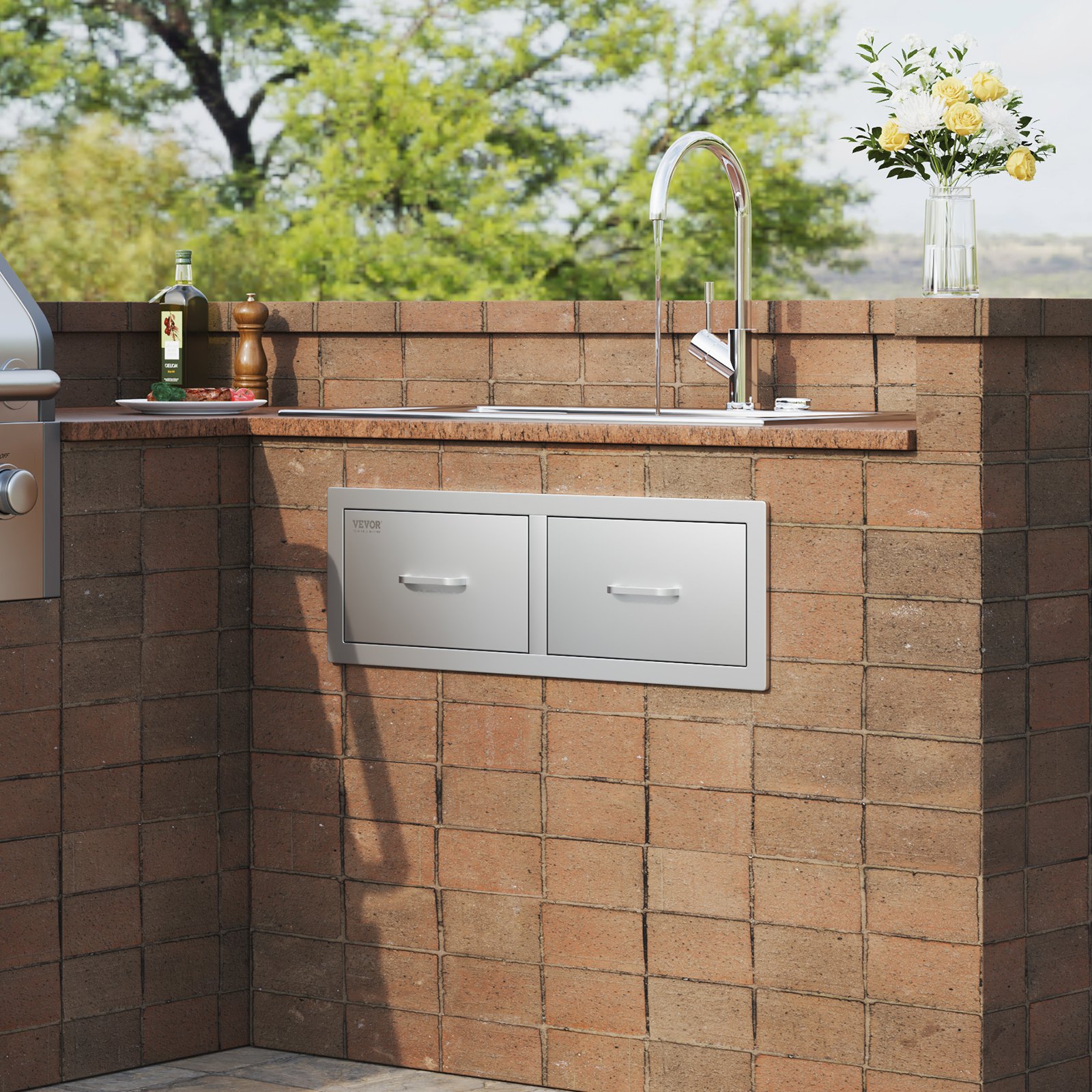 brick outdoor kitchen with VEVOR outdoor kitchen drawers, faucet, and decorative vase.