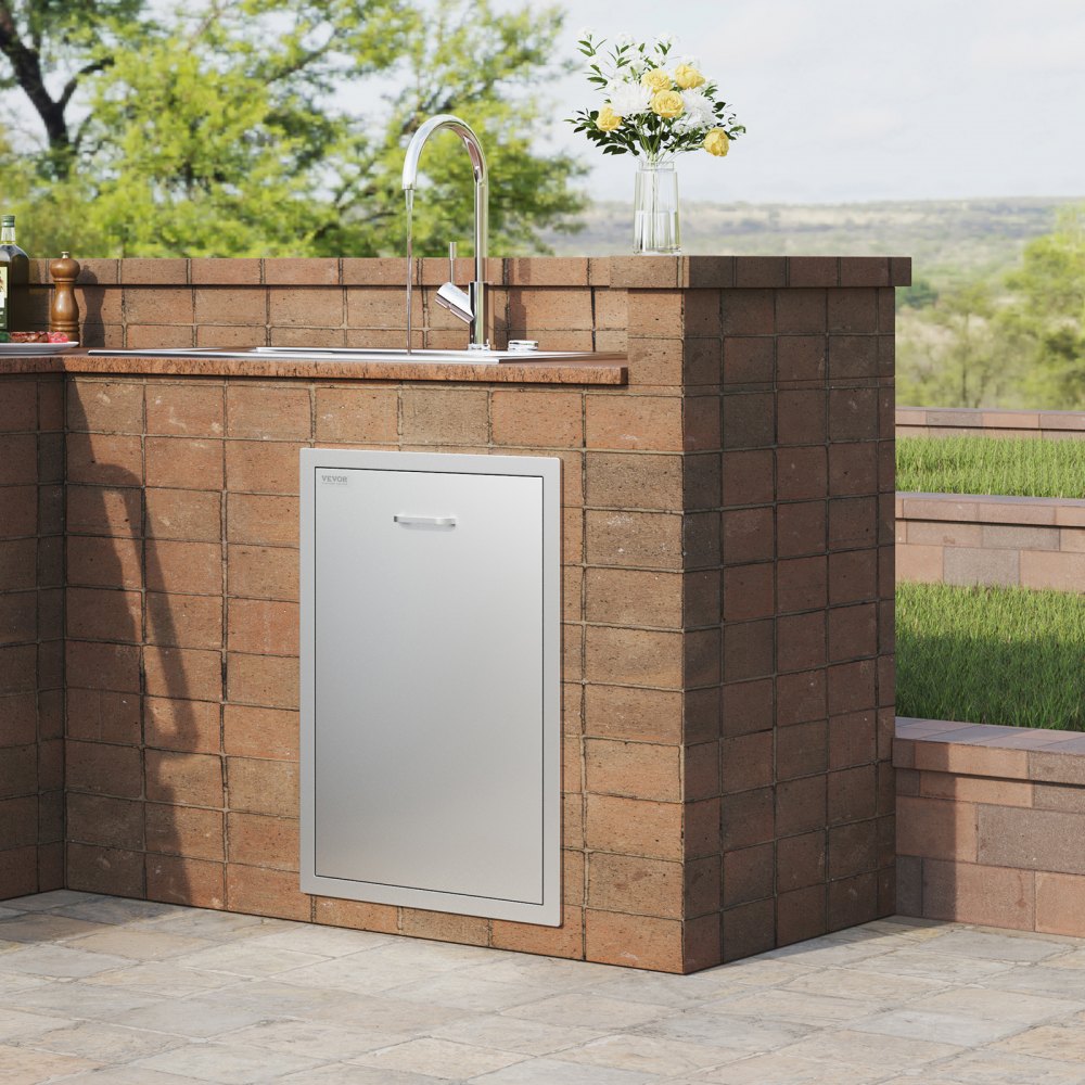 outdoor kitchen with stainless steel VEVOR pull out trash drawer in brick counter.