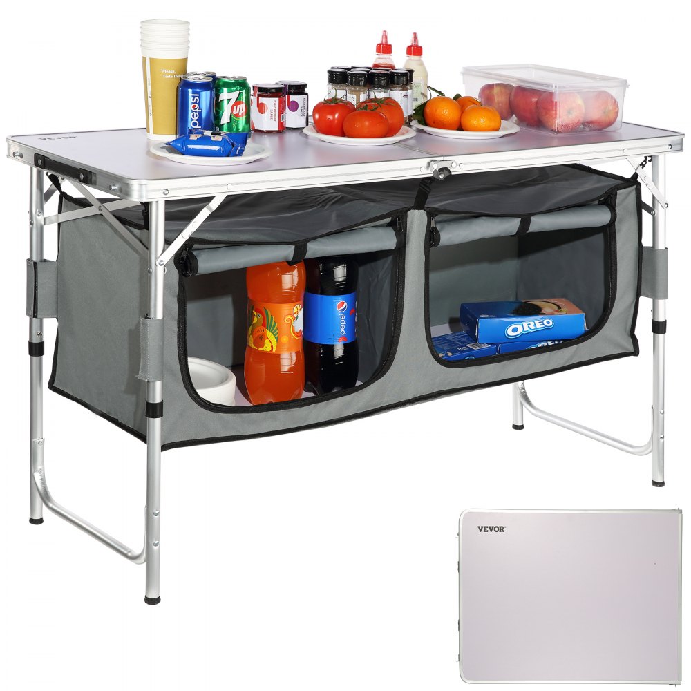 VEVOR camping table with storage compartment, loaded with snacks, drinks, and condiments for outdoor use.