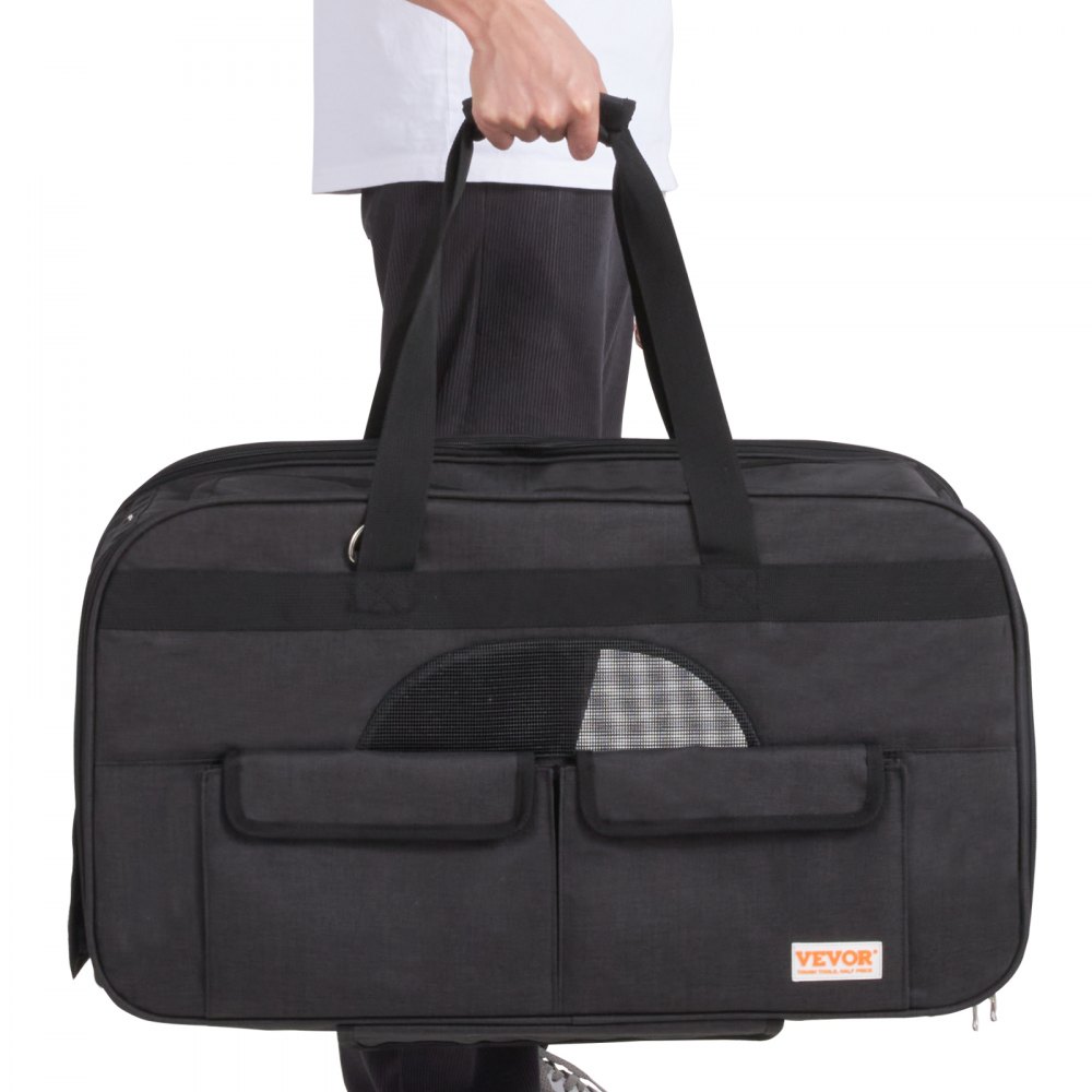 person holding black VEVOR cat carrier with wheels and pockets, showcasing its portable design.