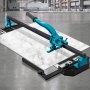 VEVOR tile cutter on a gray industrial floor cutting a large white tile.
