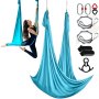 woman using VEVOR aerial yoga hammock in blue, with straps, carabiners, and accessories displayed nearby.