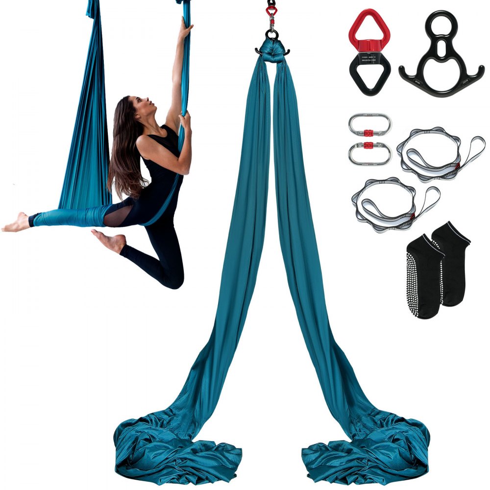 a woman using a VEVOR aerial yoga swing with included accessories like carabiners and anti-slip socks.