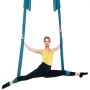 woman performing splits in mid-air using blue VEVOR aerial yoga swing, wearing yellow tank top and black leggings.