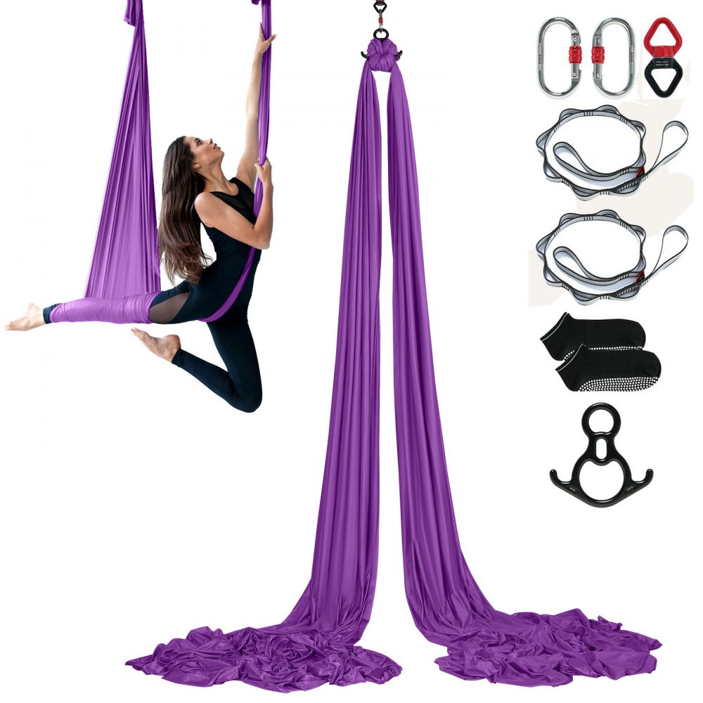 femme effectuant du yoga aérien sur un hamac de yoga aérien VEVOR violet avec accessoires inclus.