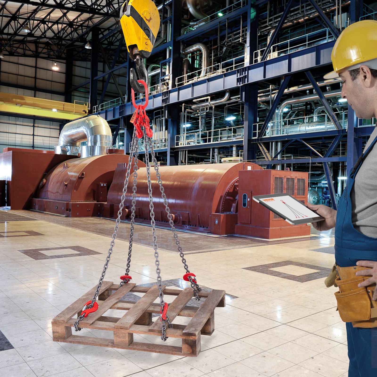 industrial worker using VEVOR chain sling to lift a wooden pallet in a factory setting.