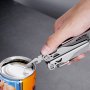 hand using VEVOR multitool pliers to open a can against a gray background.