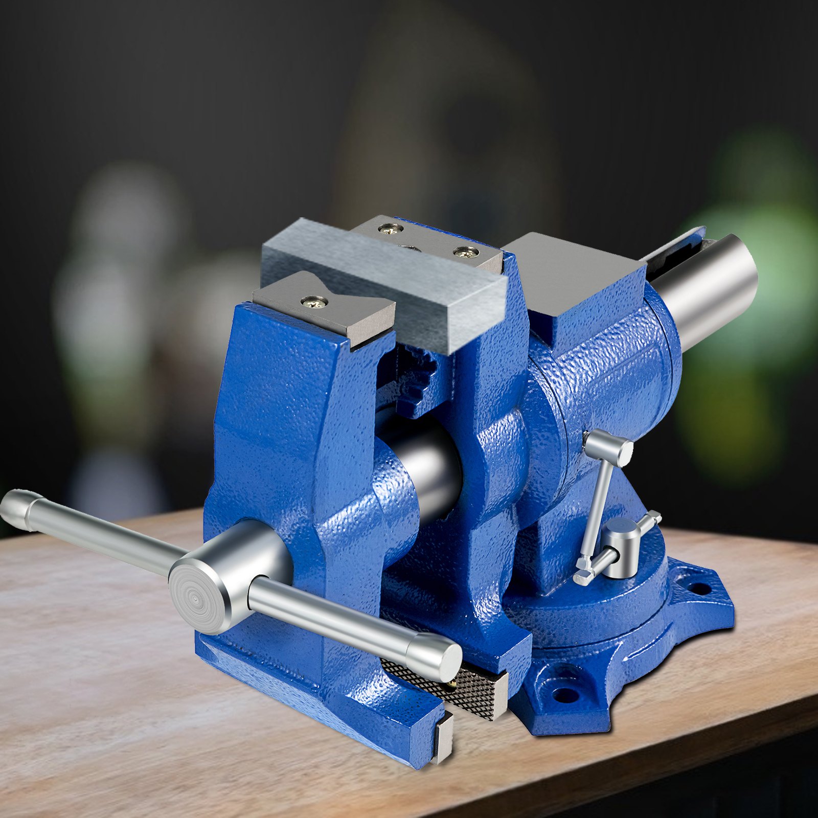 blue VEVOR bench vise mounted on a wooden surface with a dark blurred background.