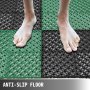 feet on wet VEVOR interlocking deck tiles, featuring anti-slip green and black design.