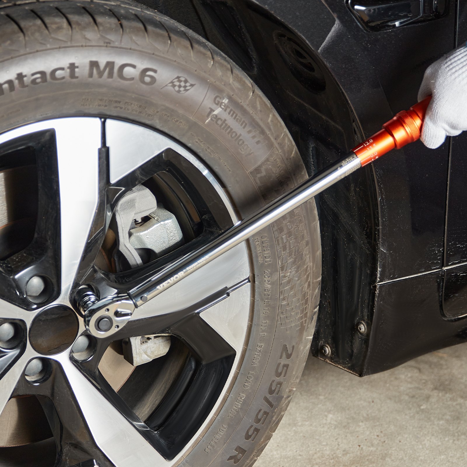 tightening a wheel bolt with VEVOR torque wrench set on a car tire with continental contact mc6 tire.