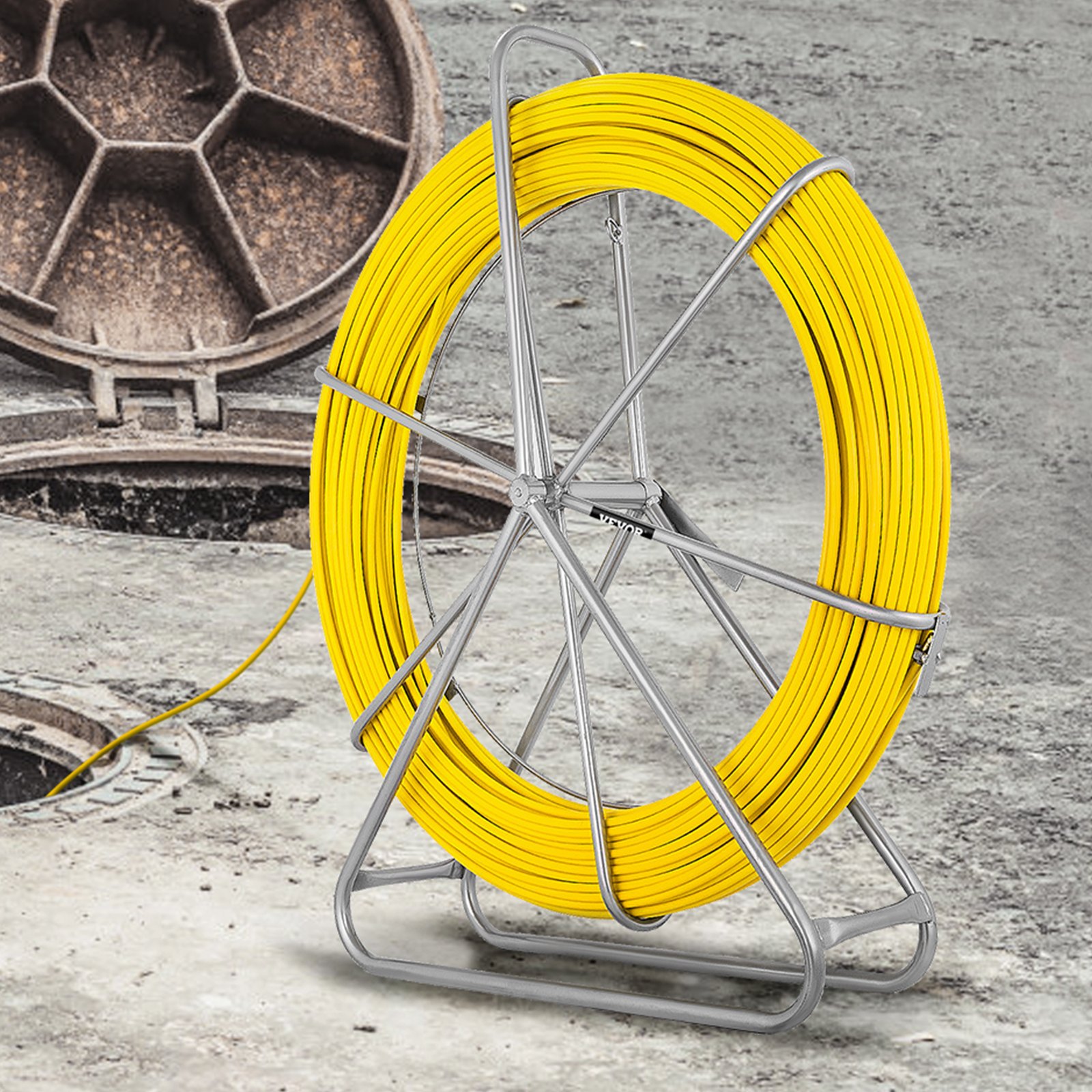 VEVOR fiberglass fish tape on stand near manholes on concrete background.