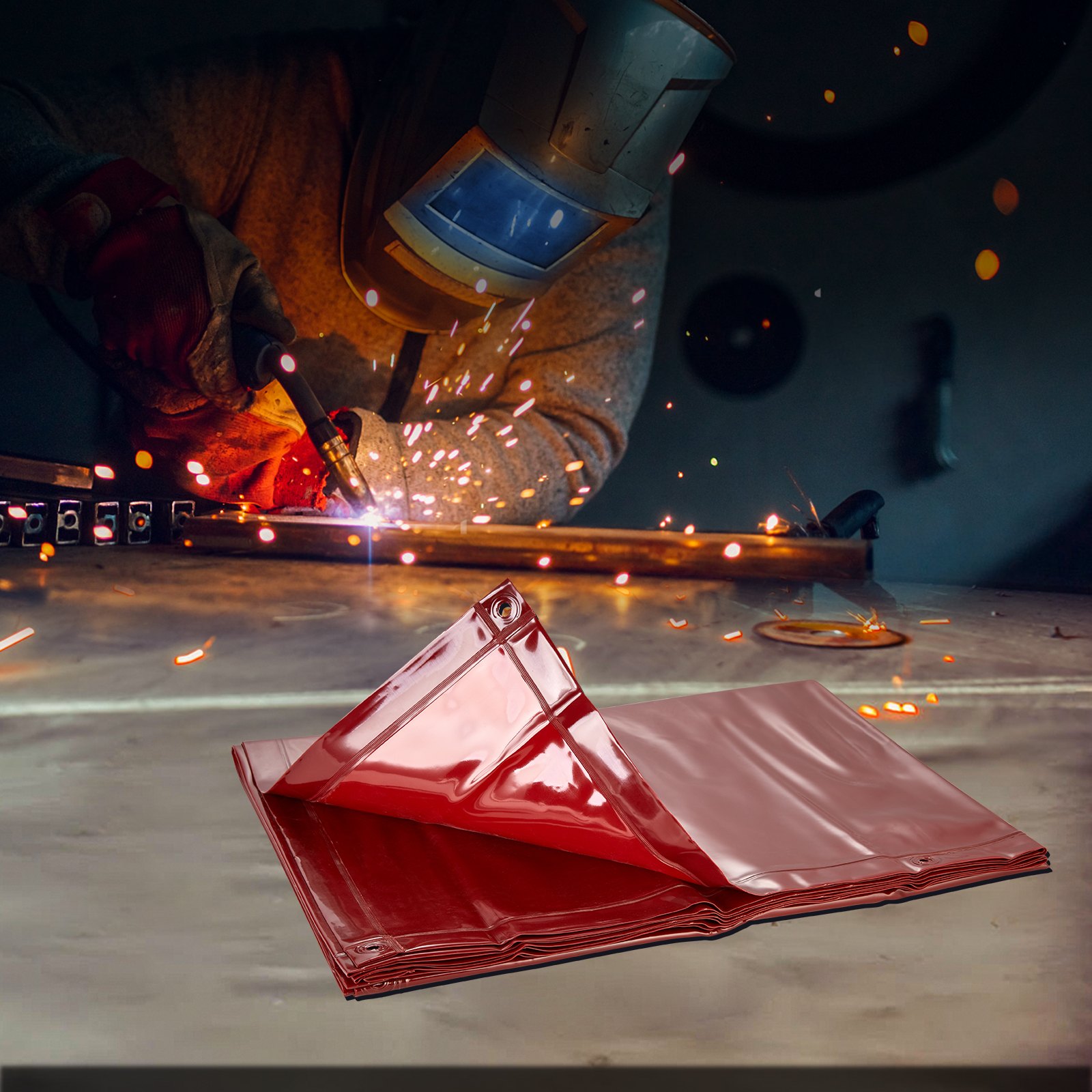 welder using torch with sparks flying, VEVOR welding screen folded in front on the workbench.