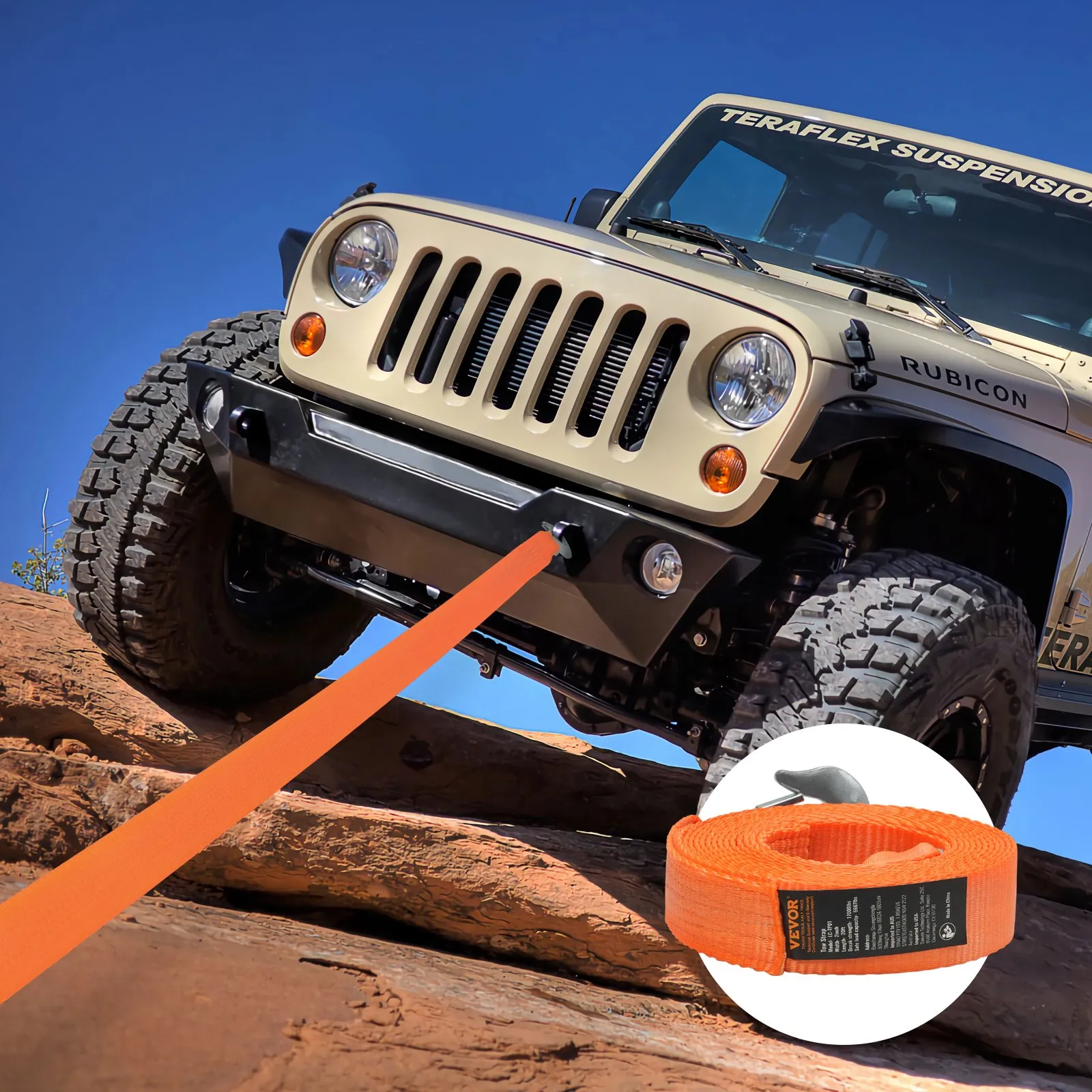 jeep on rocky terrain towing with a VEVOR tow strap, blue sky backdrop.