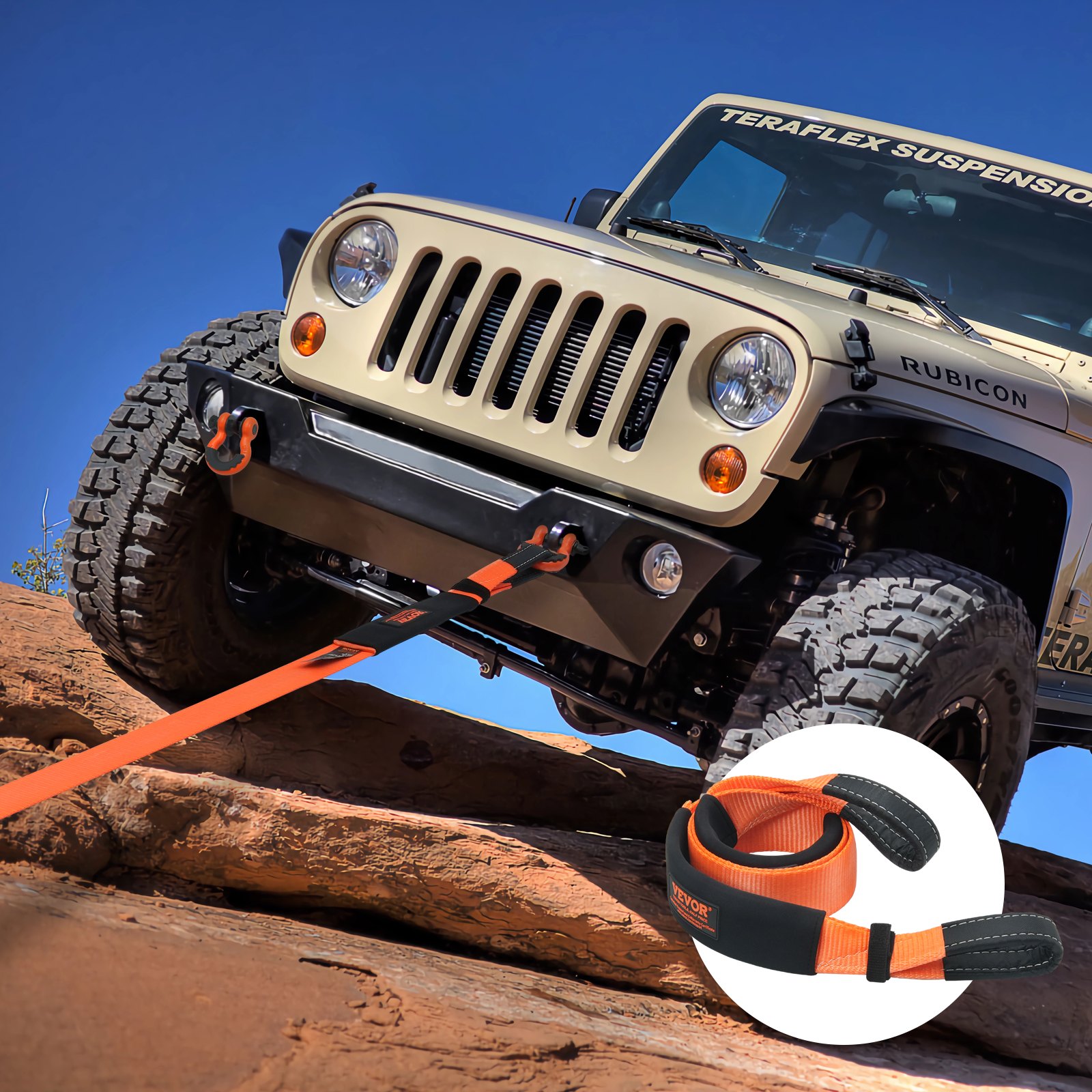 jeep climbing over rocks with a VEVOR tow strap attached for off-road recovery.