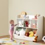 toddler reaches for toys on VEVOR toy storage organizer with books, stuffed animals, and playful decor.