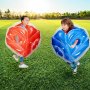 kids playing in a park with VEVOR inflatable bumper balls, one red and one blue, on a sunny day.
