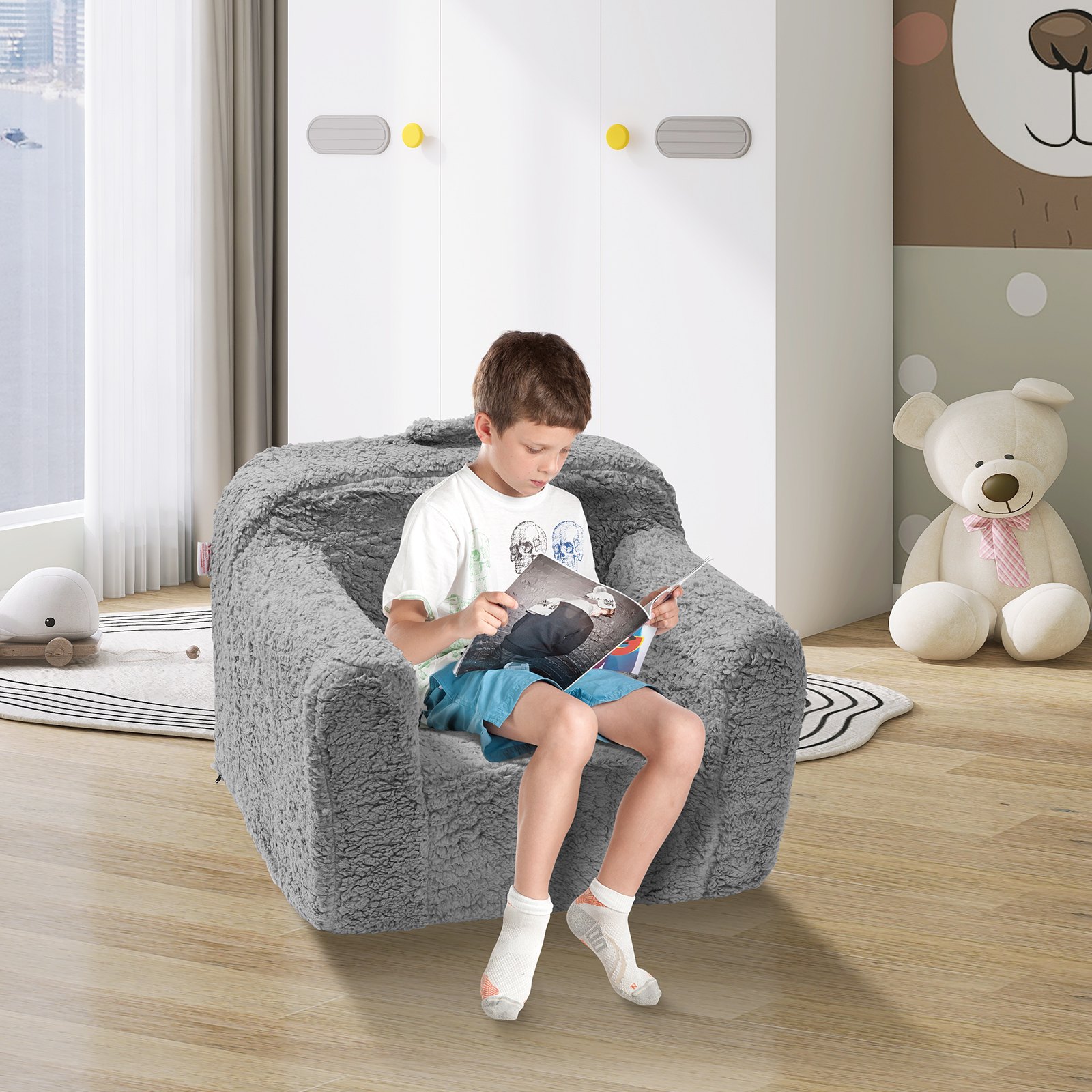child reading on a cozy grey VEVOR kids armchair in a bright, playful room with a teddy bear in the background.