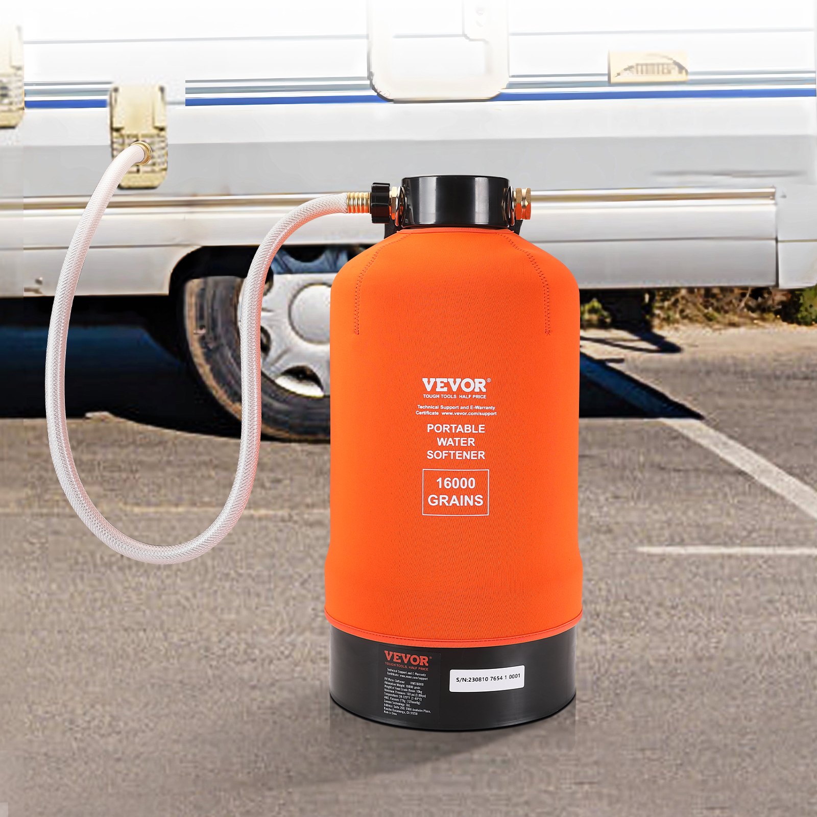VEVOR rv water softener in bright orange, connected to an rv&#039;s water supply, parked outdoors.