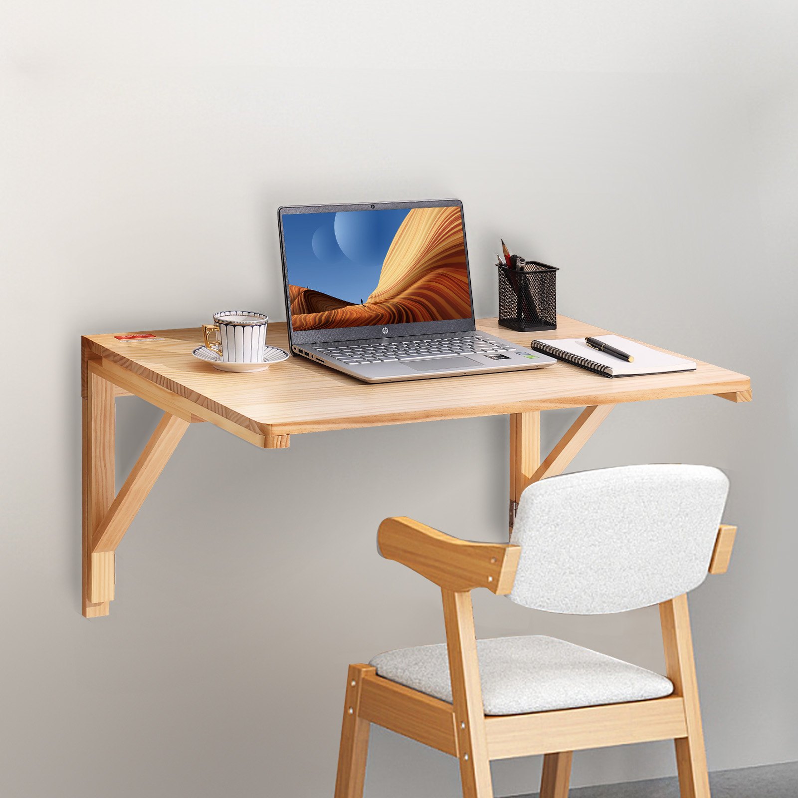VEVOR wall mounted folding table with laptop, notebook, coffee cup, and chair in a minimalist workspace.