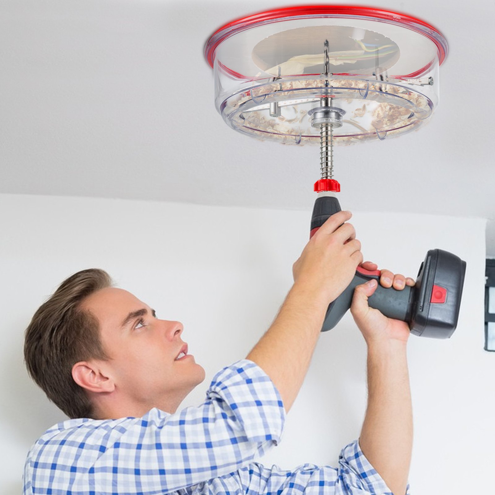 person using VEVOR hole saw cutter kit with drill on a white ceiling.