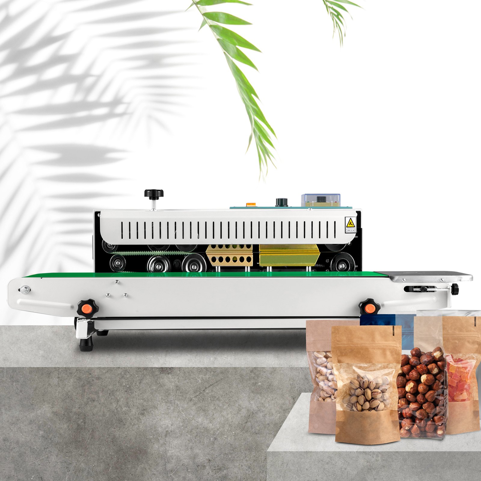 VEVOR band sealer with sealed bags of nuts and dried fruit on a concrete surface.
