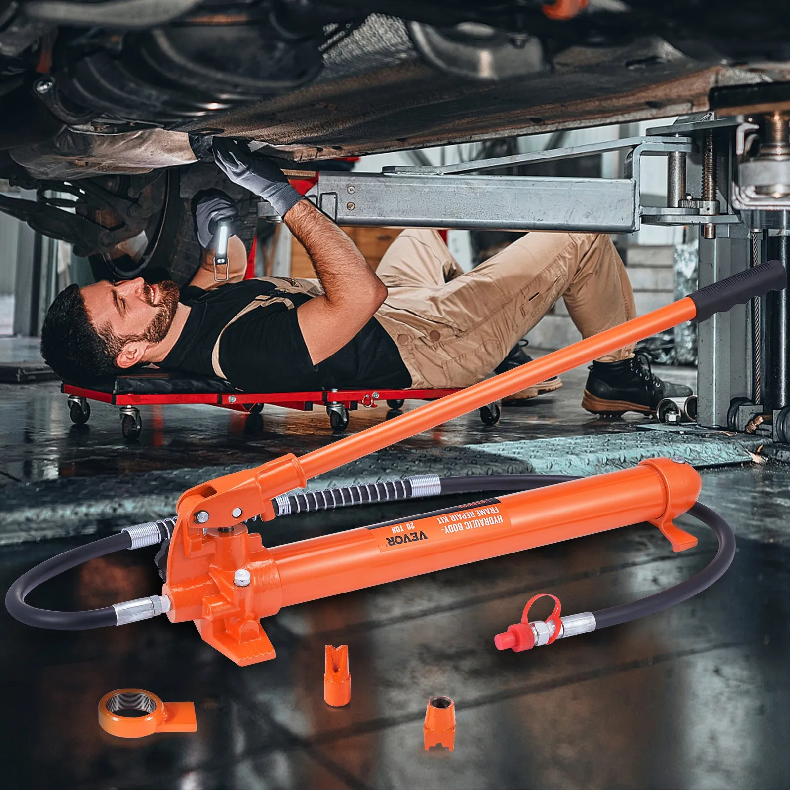 mechanic working under a vehicle using a VEVOR 20 ton porta power kit with orange hydraulic pump.