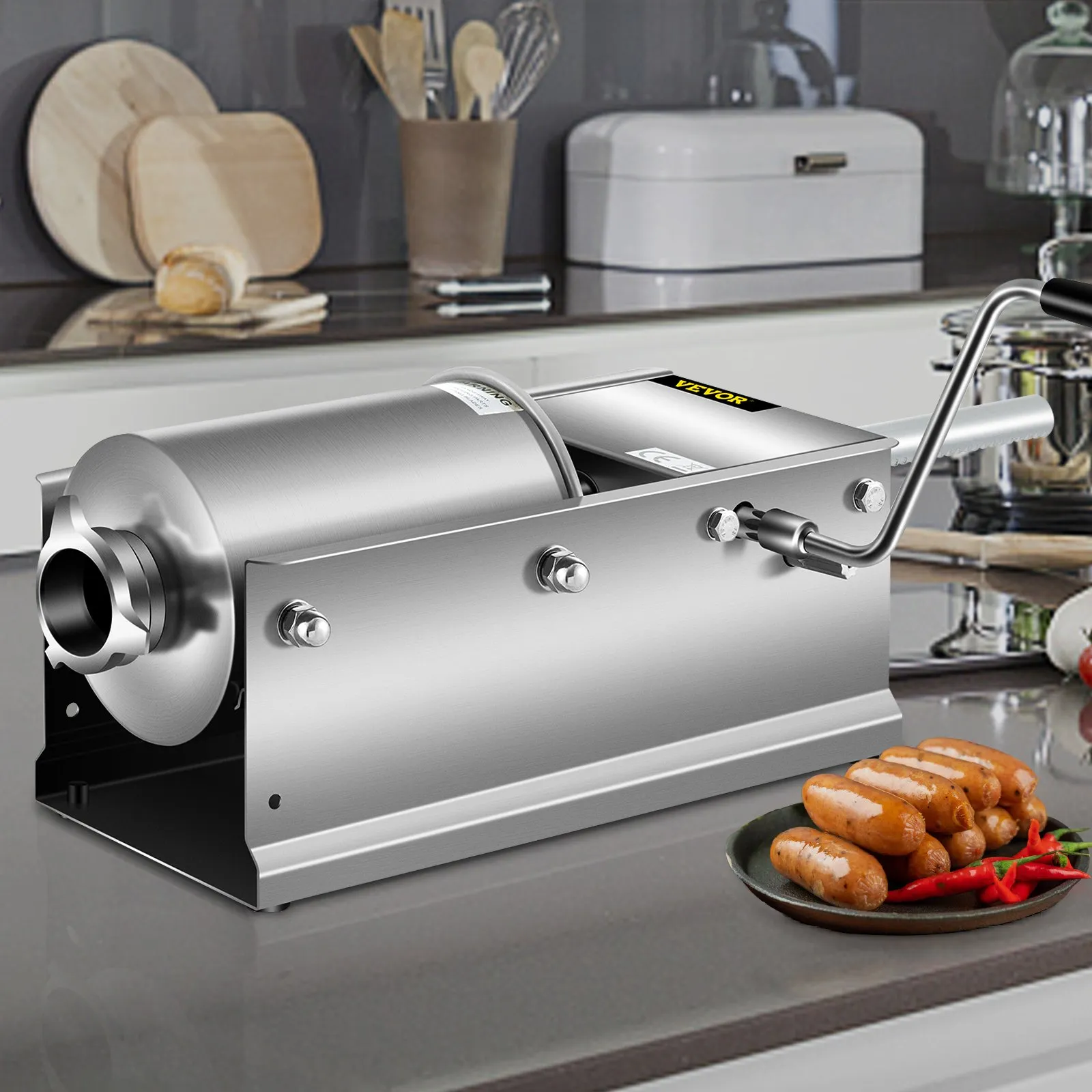VEVOR sausage stuffer on a kitchen counter with sausages and red chilies.