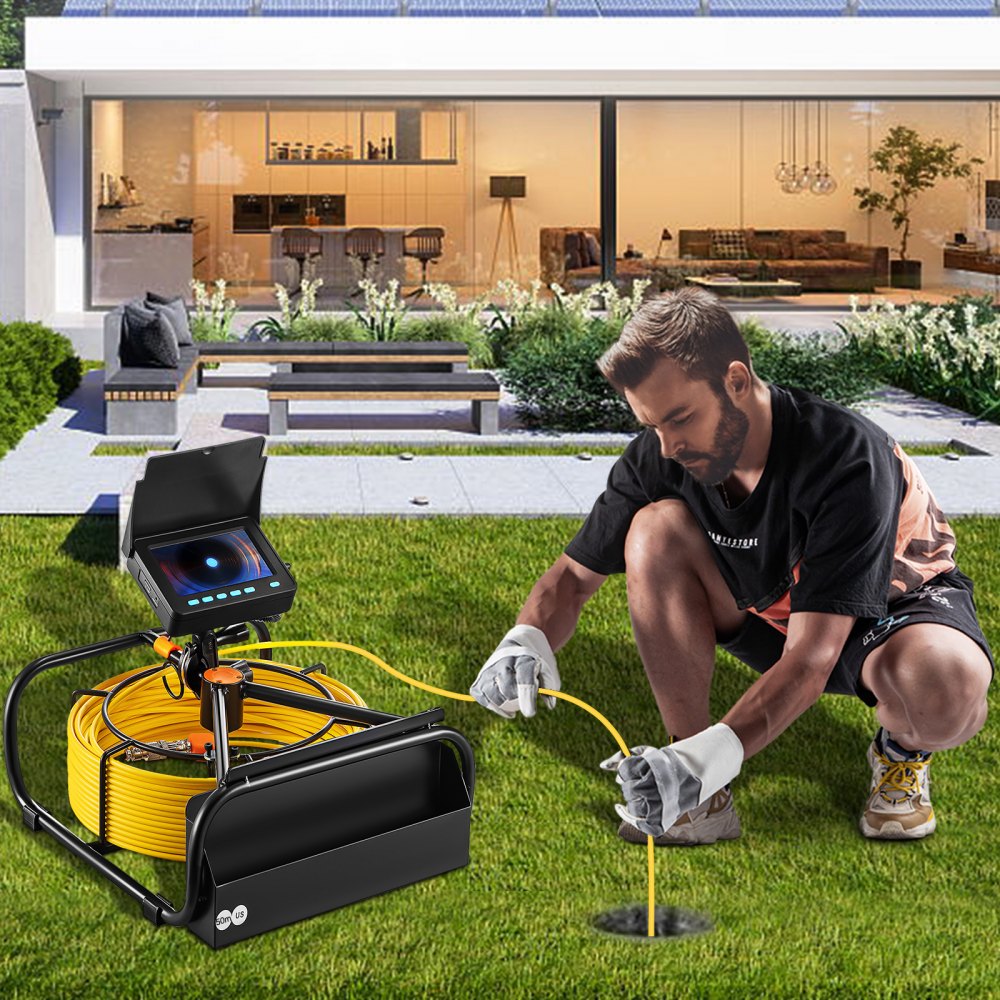 person using VEVOR sewer camera on a grassy lawn in front of a modern house.
