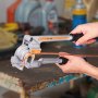 hands using a VEVOR pipe tube bender on a copper pipe in a workshop.