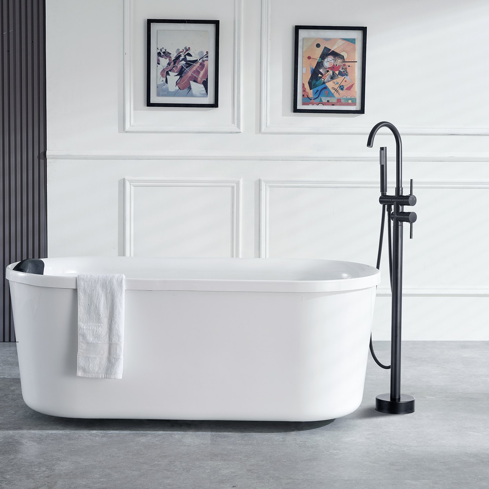 modern bathroom with a white free-standing bathtub, VEVOR freestanding bathtub faucet, and two framed artworks.