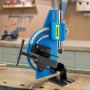 VEVOR pipe notcher tool on workshop bench with background tools.