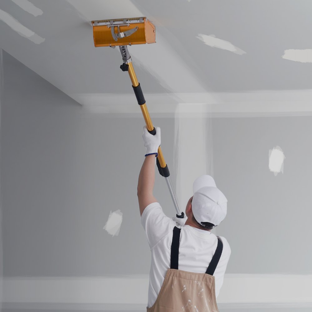 worker using VEVOR drywall flat box handle on ceiling, wearing white gloves, cap, and protective apron.