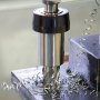 annular cutter drilling through steel with metal shavings around, showcasing VEVOR annular cutter set.