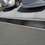 VEVOR curb ramp installed on driveway for smooth vehicle access.