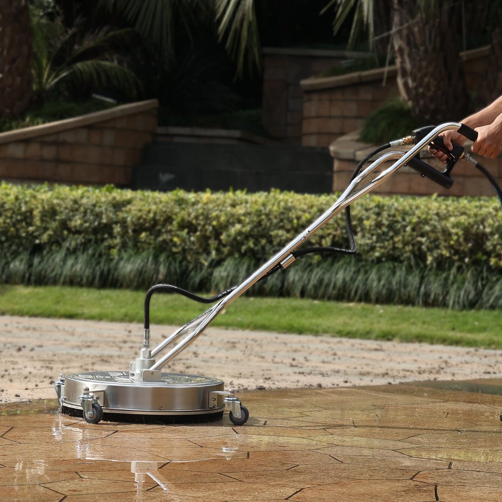 person using VEVOR pressure washer surface cleaner on a tile patio with garden background.