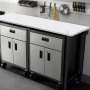 VEVOR standing desk countertop with diamond plate cabinets and tools on wall in background.