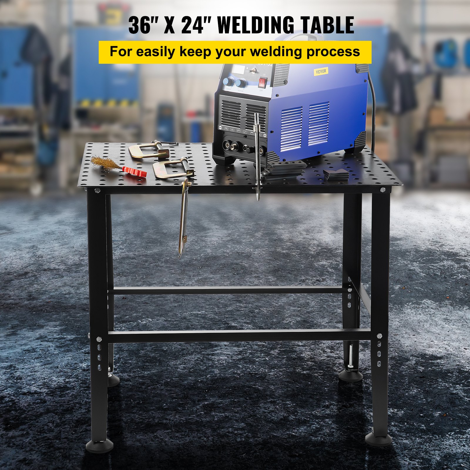 VEVOR welding table with tools and equipment in a workshop setting.