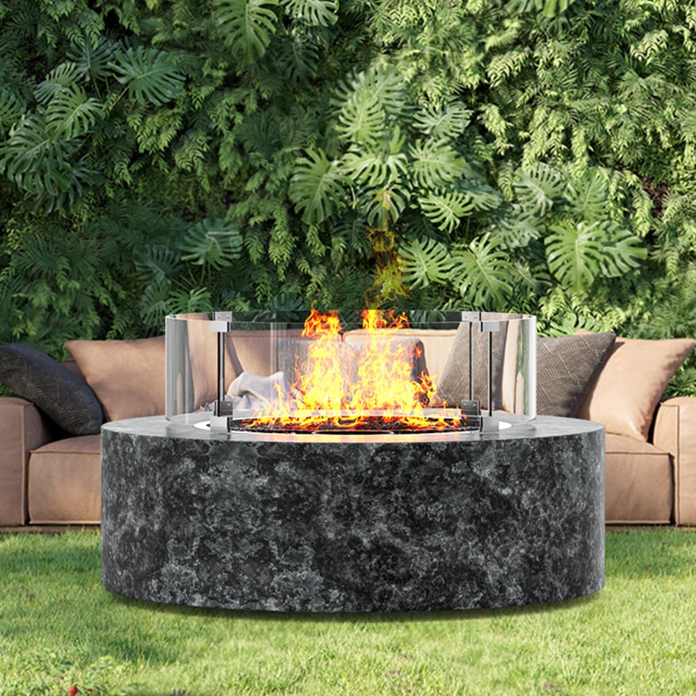 VEVOR fire pit wind guard on a round stone fire pit, with lush green foliage and outdoor seating.