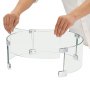 assembling VEVOR fire pit wind guard with curved glass panels and silver brackets.