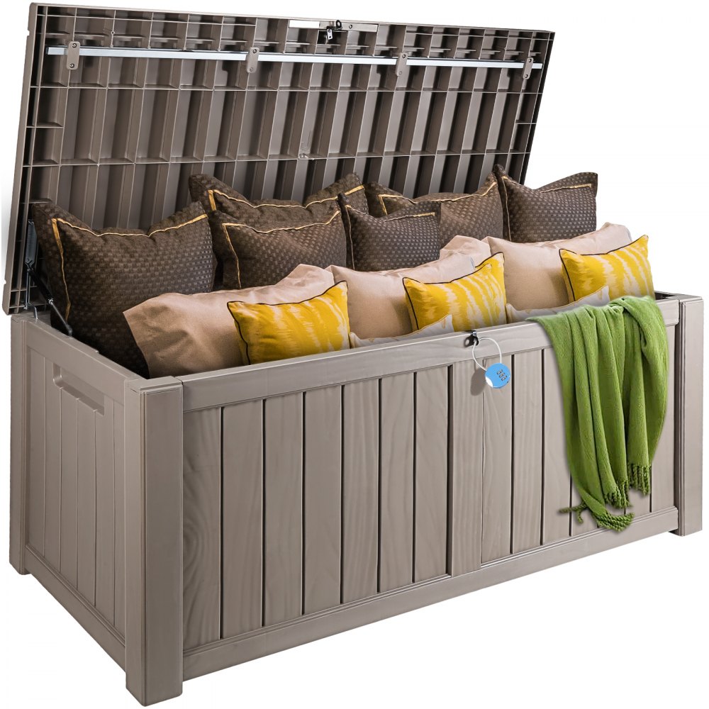 beige VEVOR deck box storing assorted pillows and a green blanket inside with an open lid.