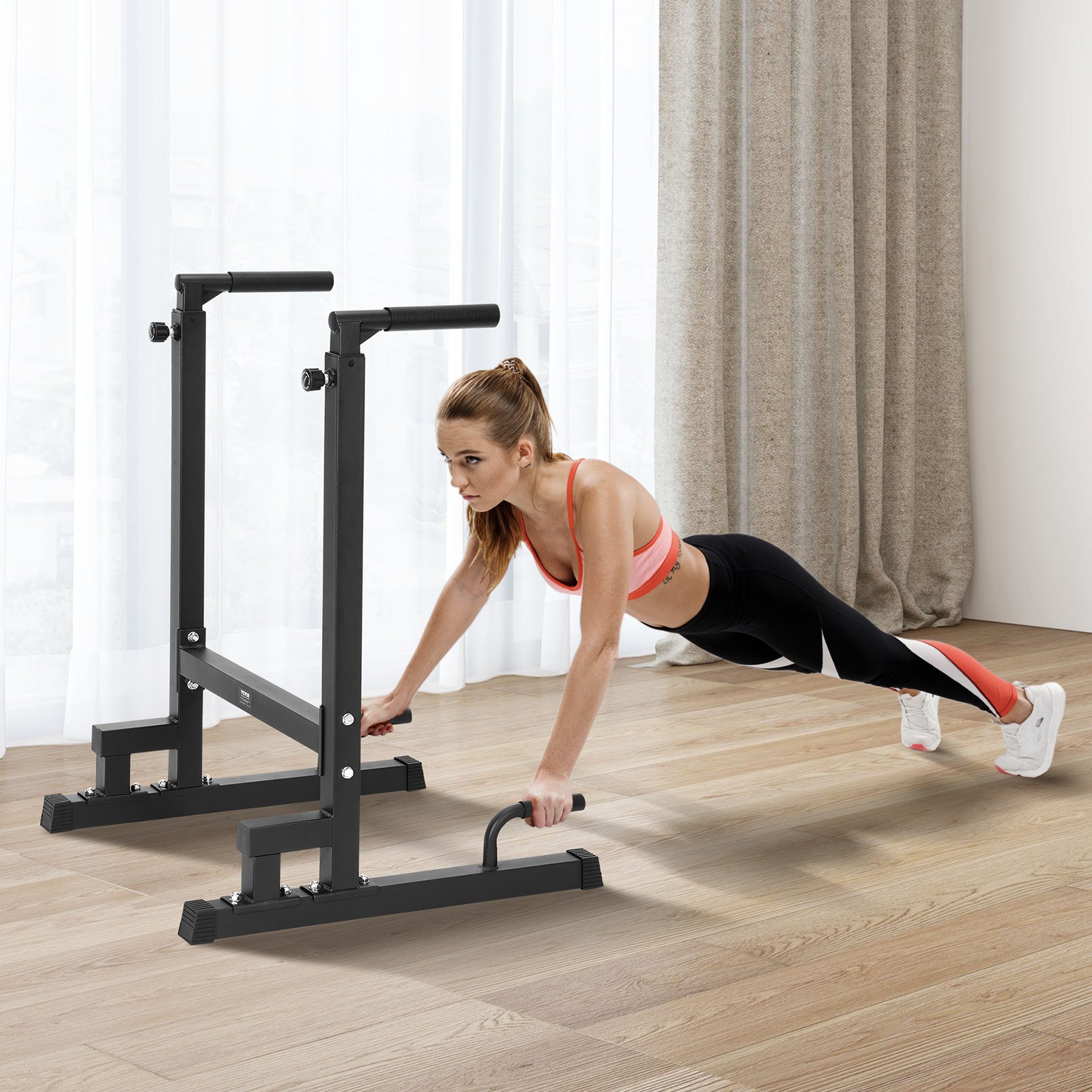 individual performs exercises using the VEVOR dip bar in a home gym with light and open space.