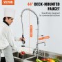 chef using a VEVOR commercial faucet to rinse a tomato in a stainless steel sink with vegetable produce.