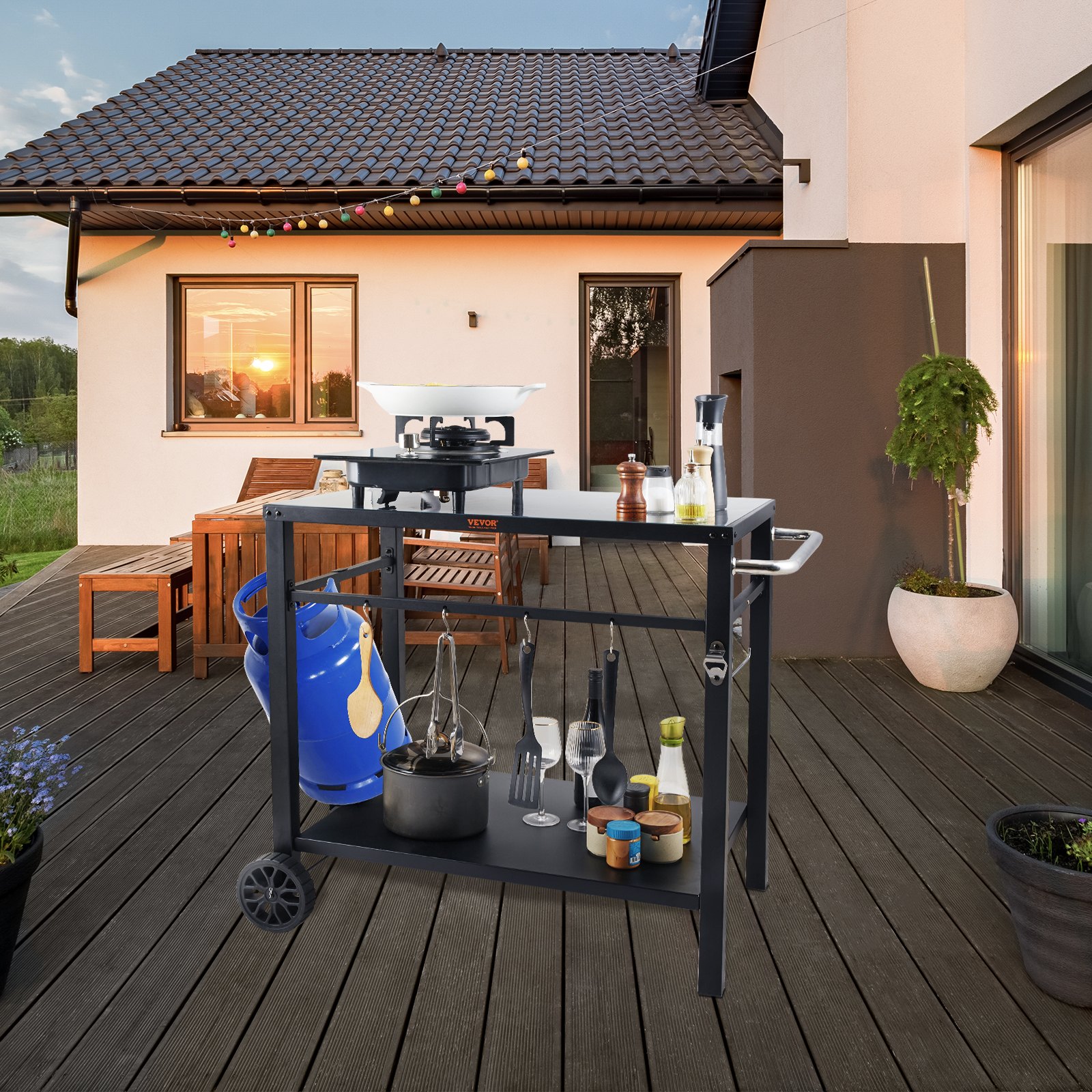 VEVOR outdoor grill cart on a wooden deck with utensils, gas cylinder, plants, and cozy patio setup.