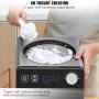 person using a VEVOR ice cream maker, scooping freshly made yogurt with digital display showing 60:00.